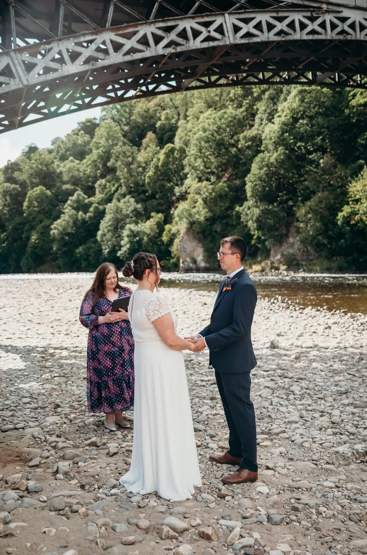 Laura Gordon conducting an outdoor wedding ceremony at Craigellachie Bridge in Moray, Scotland